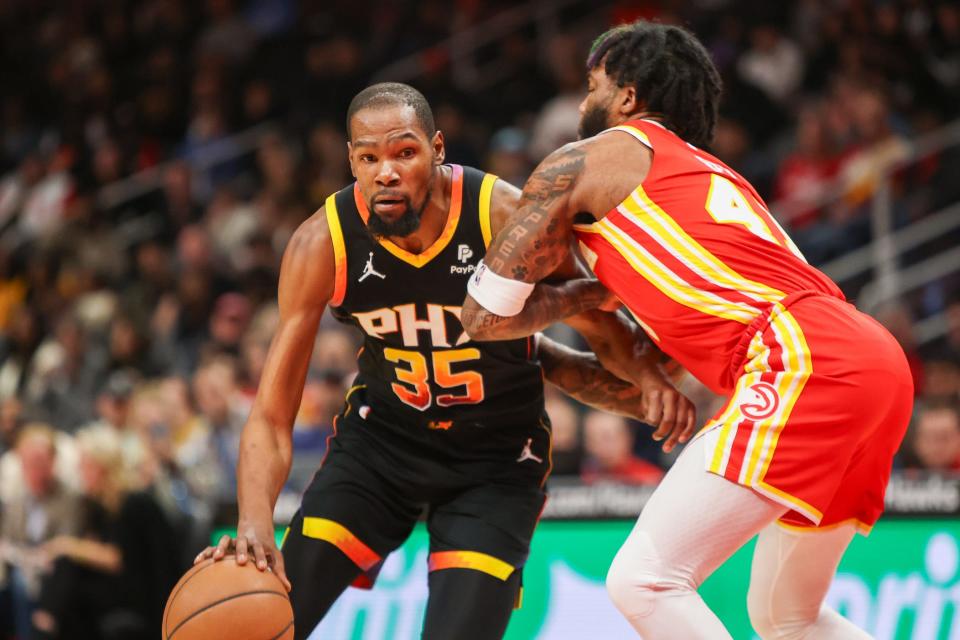 Feb 2, 2024; Atlanta, Georgia, USA; Phoenix Suns forward Kevin Durant (35) drives on Atlanta Hawks forward Saddiq Bey (41) in the first quarter at State Farm Arena.