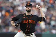 San Francisco Giants' Alex Wood pitches against the Atlanta Braves during the first inning of a baseball game in San Francisco, Saturday, Sept. 18, 2021. (AP Photo/Jeff Chiu)