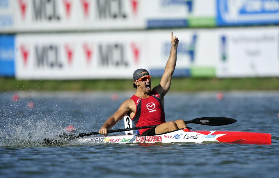 Canada's Adam van Koeverden celebrates his victory at the finish line of men's K1 1000m final of the 39th ICF Flatwater world championships at the Matyeri Lake of Szeged on August 19, 2011. AFP PHOTO / ATTILA KISBENEDEK (Photo credit should read ATTILA KISBENEDEK/AFP/Getty Images)