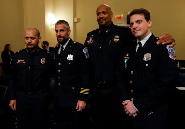 U.S. Capitol Police Sgt. Aquilino Gonell, Metropolitan Police Department Officer Michael Fanone, U.S. Capitol Police Officer Harry Dunn and Metropolitan Police Officer Daniel Hodges stand together on July 27 following the opening hearing of the House select committee investigating the Jan. 6 attack on the U.S. Capitol. (Photo: Jim Bourg via Reuters)