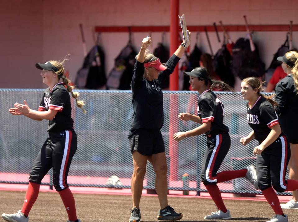 Lubbock-Cooper celebrates their win against Plainview in Game 2 of a Class 5A bi-district softball series, Saturday, April 27, 2024, at Lady Bulldog Park in Plainview.