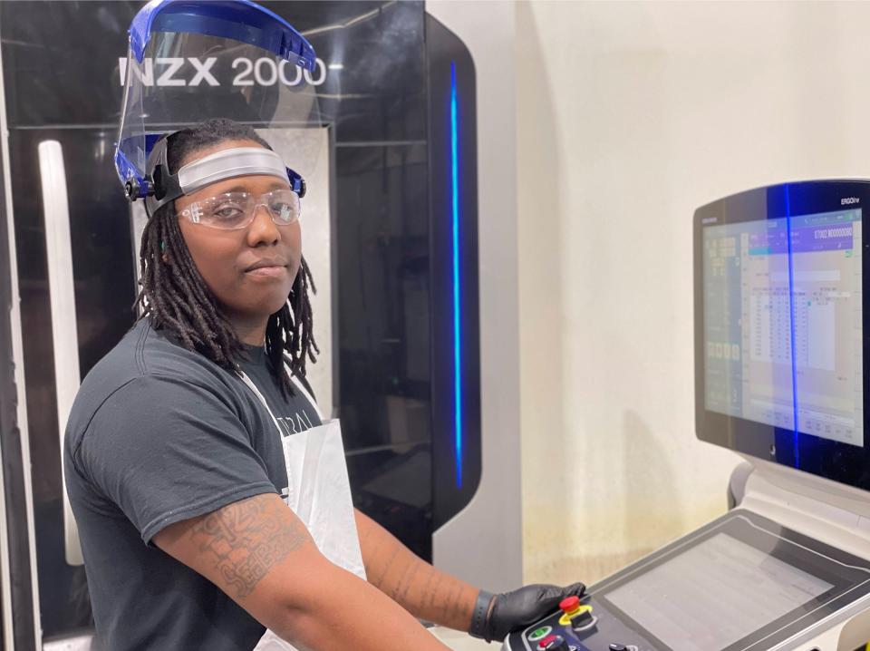 Marcus McCline operates a machine in the Caterpillar-Pontiac factory. A machinist position is one that is currently being offered at the Pontiac campus.