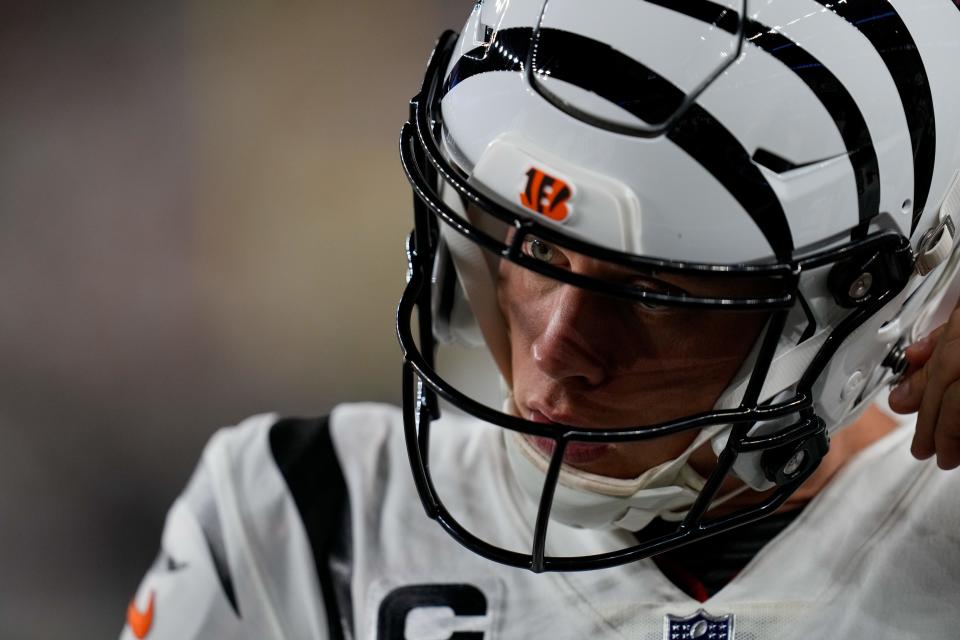 Cincinnati Bengals quarterback <a class="link " href="https://sports.yahoo.com/nfl/players/32671" data-i13n="sec:content-canvas;subsec:anchor_text;elm:context_link" data-ylk="slk:Joe Burrow;sec:content-canvas;subsec:anchor_text;elm:context_link;itc:0">Joe Burrow</a> (9) prepares to take over between drives in the first quarter of the NFL Week 3 game between the Cincinnati Bengals and the <a class="link " href="https://sports.yahoo.com/nfl/teams/la-rams/" data-i13n="sec:content-canvas;subsec:anchor_text;elm:context_link" data-ylk="slk:Los Angeles Rams;sec:content-canvas;subsec:anchor_text;elm:context_link;itc:0">Los Angeles Rams</a> at Paycor Stadium in downtown Cincinnati on Monday, Sept. 25, 2023. The game was tied 6-6 at halftime.