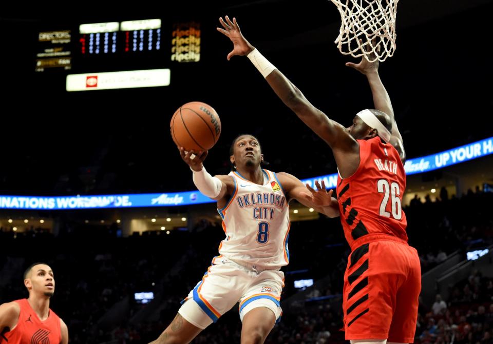 Thunder forward Jalen Williams, left, drives to the basket against Trail Blazers center Duop Reath, right, during the first half Wednesday in Portland, Ore.