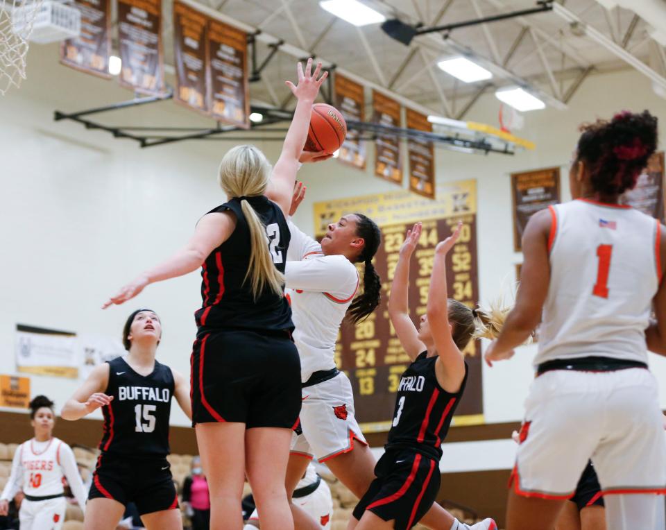 Waynesville Lady Tiger Breona Hurd goes up for a field goal during a game against the Buffalo Lady Bison in the White division during the Pink and White Tournament at Kickapoo High School on Monday, Dec. 28, 2020.