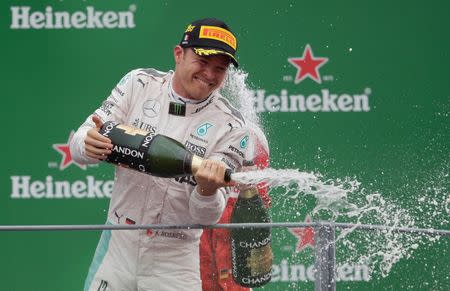 Formula One - F1 - Italian Grand Prix 2016 - Autodromo Nazionale Monza, Monza, Italy - 4/9/16 Mercedes' Nico Rosberg celebrates his win on the podium after the race Reuters / Max Rossi Livepic