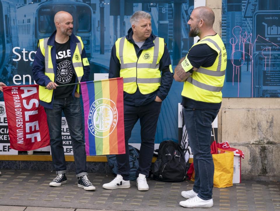 Protesters on the picket line outside Leeds train station (Danny Lawson/PA) (PA Wire)