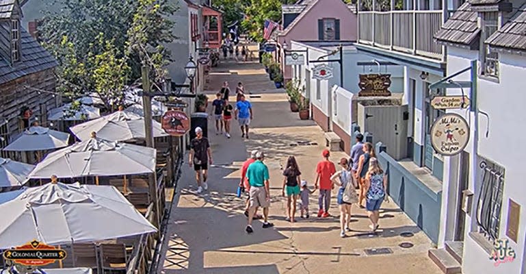 Couples, families, lone walkers amble down St. George Street in downtown St. Augustine, seen ia the St. Augustine Live web cam.