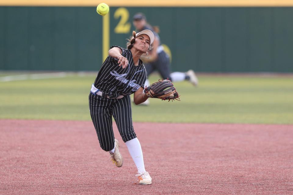 Santa Gertrudis Academy's Audi Mireles throws to first base during the Region IV-3A softball final at Cabaniss Softball Field on Thursday, May 25, 2023, in Corpus Christi, Texas.