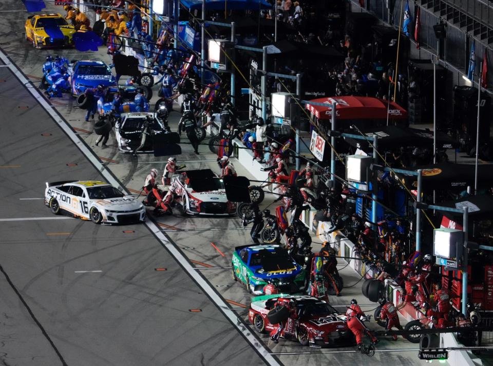 Cars come into pit after the end of the first stage during Saturday's Coke Zero Sugar 400 at Daytona.