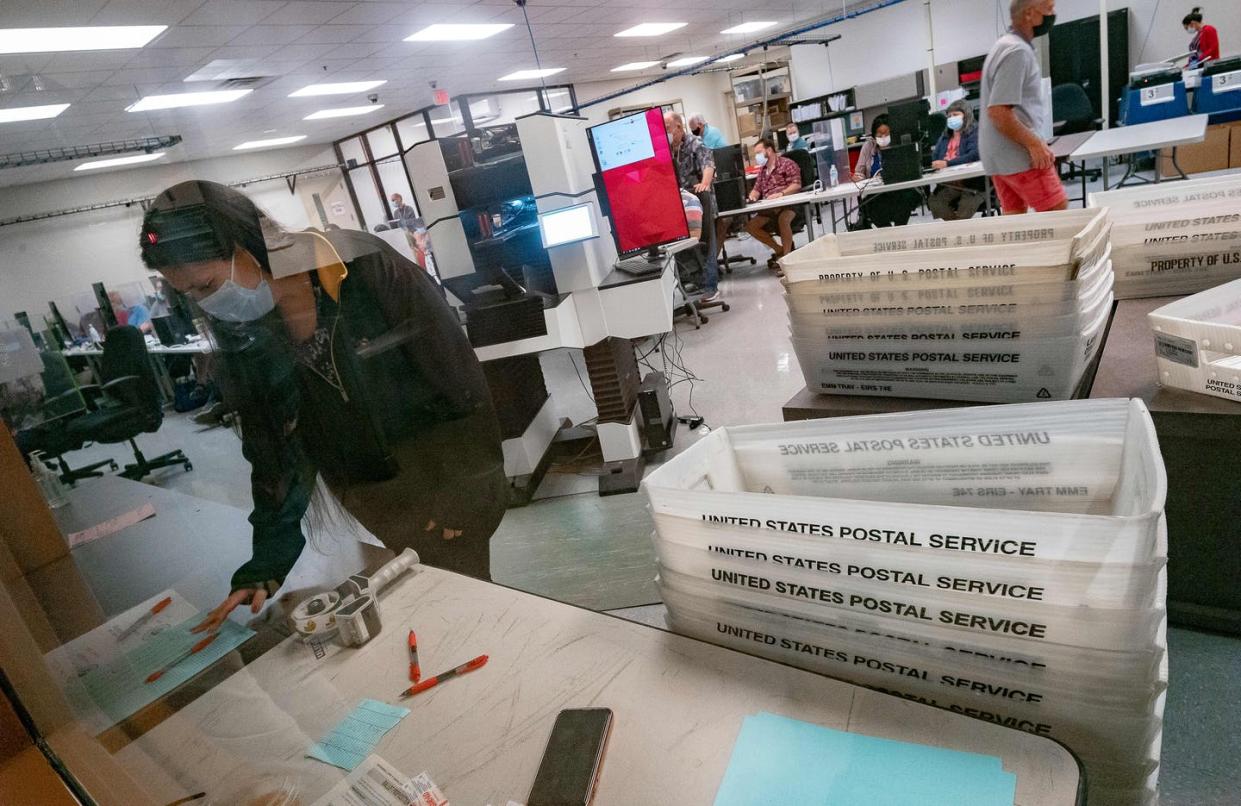 <span class="caption">The Maricopa County Election Department counts ballots in Phoenix on Nov. 5, 2020. Arizona's election laws are the subject of a pending Supreme Court decision.</span> <span class="attribution"><a class="link " href="https://www.gettyimages.com/detail/news-photo/poll-workers-count-ballots-inside-the-maricopa-county-news-photo/1229479434?adppopup=true" rel="nofollow noopener" target="_blank" data-ylk="slk:Olivier Touron/AFP via Getty Images;elm:context_link;itc:0;sec:content-canvas">Olivier Touron/AFP via Getty Images</a></span>