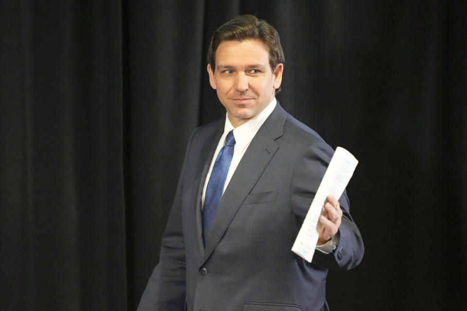 Florida Gov. Ron DeSantis acknowledges supporters as he arrives at a news conference at the Reedy Creek Administration Building, Monday, April 17, 2023, in Lake Buena Vista, Fla. (AP Photo/John Raoux)