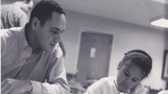 Clifford Alexander listens as his daughter, Elizabeth, explains her science project.