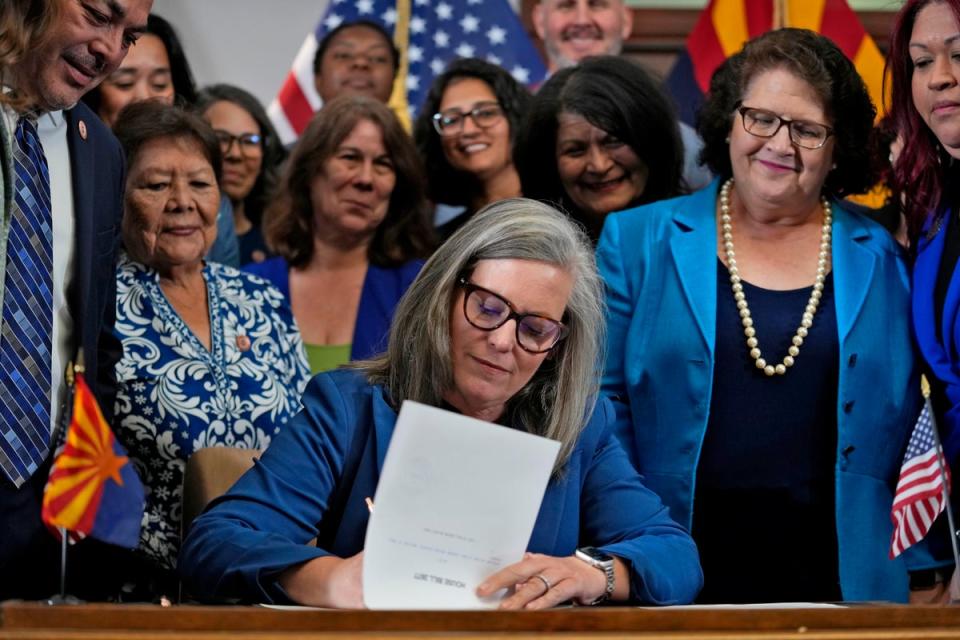 Arizona Gov Katie Hobbs signs the repeal of the Civil War-era near-total abortion ban on 2 May 2024 (AP)