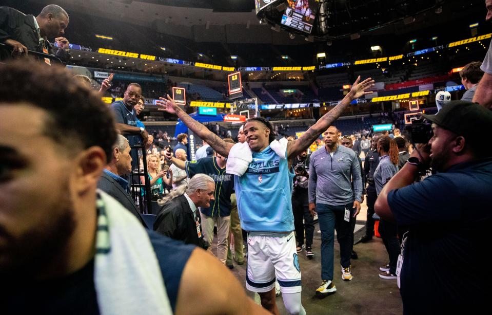 Memphis Grizzlies guard Ja Morant (12) celebrates after winning a preseason game against the Orlando Magic on Monday, Oct. 3, 2022, at FedExForum. The Memphis Grizzlies defeated the Orlando Magic 109-97.