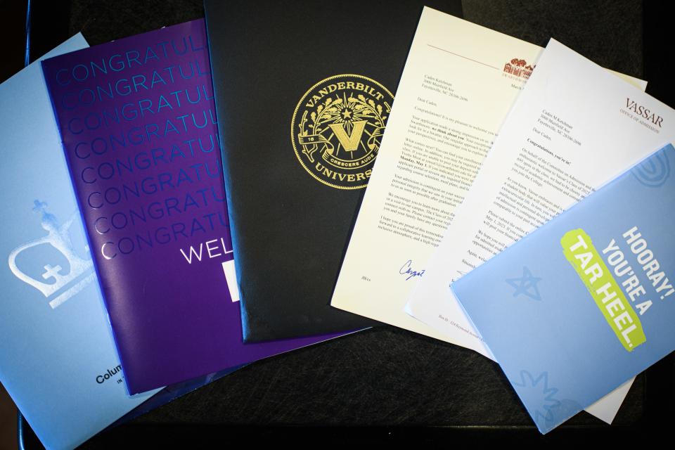 Some of the acceptance letters and packets that Caden Ketchman received from top-tier universities.