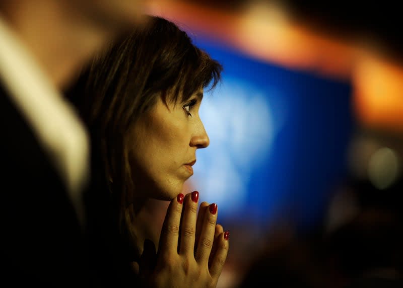 Nancy French watches vote results displayed on a television during Republican presidential candidate and former Massachusetts Gov. Mitt Romney's election night rally, Tuesday, Nov. 6, 2012, in Boston. | David Goldman