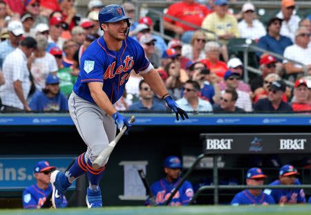 Feb 28, 2019; Jupiter, FL, USA; New York Mets infielder Pete Alonso (20) connects for a base hit against the St. Louis Cardinals at Roger Dean Chevrolet Stadium. Mandatory Credit: Steve Mitchell-USA TODAY Sports