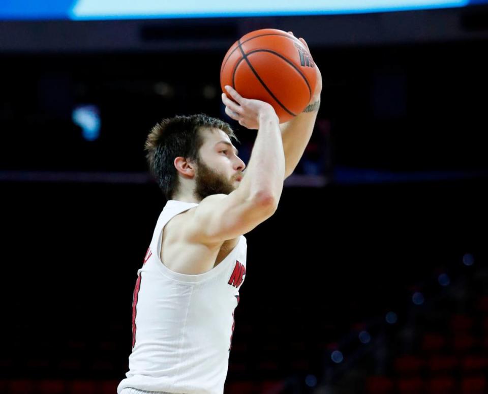 N.C. State’s Braxton Beverly (10) shoots a three-pointer during the second half of N.C. State’s 65-62 victory over Pittsburgh at PNC Arena in Raleigh, N.C., Sunday, February 28, 2021.