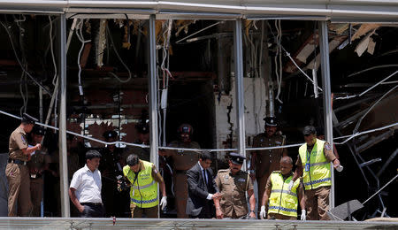 FILE PHOTO: Crime scene officials inspect the explosion area at Shangri-La hotel in Colombo, Sri Lanka April 21, 2019. REUTERS/Dinuka Liyanawatte/File Photo
