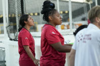 Yuli Pineda, left, cheers on her teammates as the U.S. women's team played against Sweden at the Homeless World Cup, Tuesday, July 11, 2023, in Sacramento, Calif. Pineda moved to California from Honduras and was living with a foster family when she joined the U.S. team. Pineda said she's found a sense of community playing for the team. “Every single player comes from different backgrounds,” Pineda, 18, said. “It’s amazing that in a short amount of time we have connected that fast.” (AP Photo/Godofredo A. Vásquez)