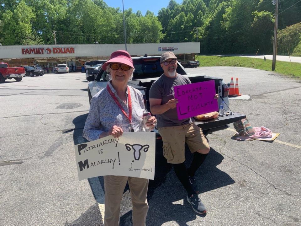 Valerie DuPuy and James Nichols were two of the community members in attendance May 11 at a student-organized women's rights rally across the street from Madison High School.