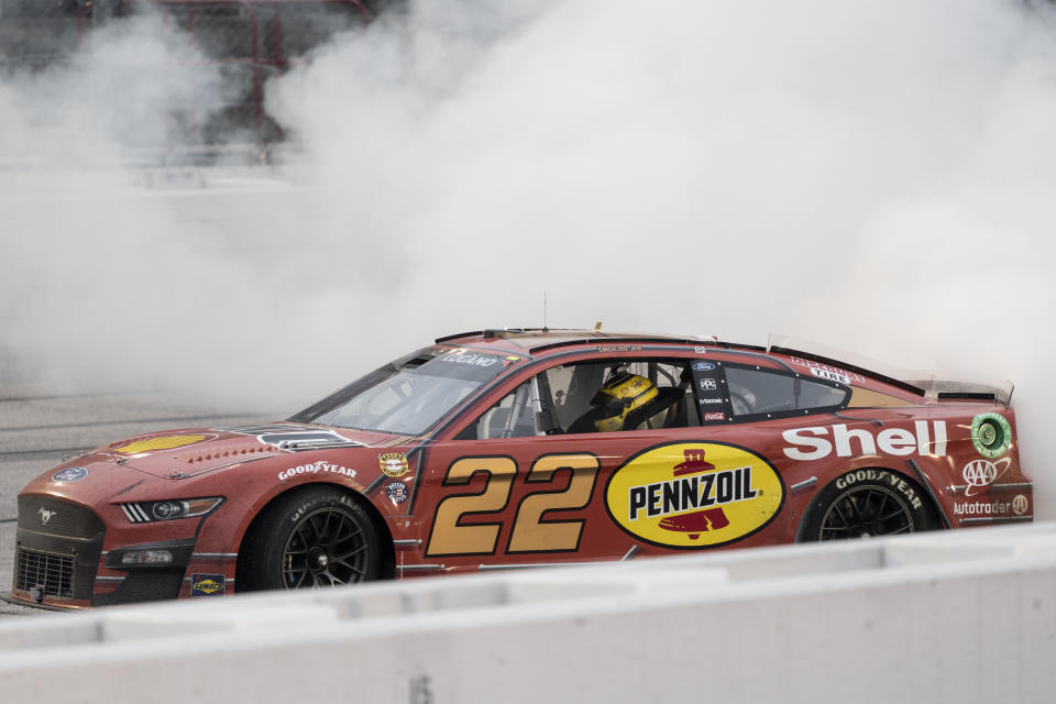 Joey Logano (22) celebrates with a burnout after winning a NASCAR Cup Series auto race at Darlington Raceway, Sunday, May 8, 2022, in Darlington, S.C. (AP Photo/Matt Kelley)