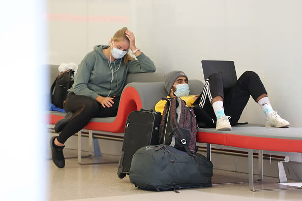 Passengers relax waiting for their flights at the Virgin Australia domestic terminal in Perth