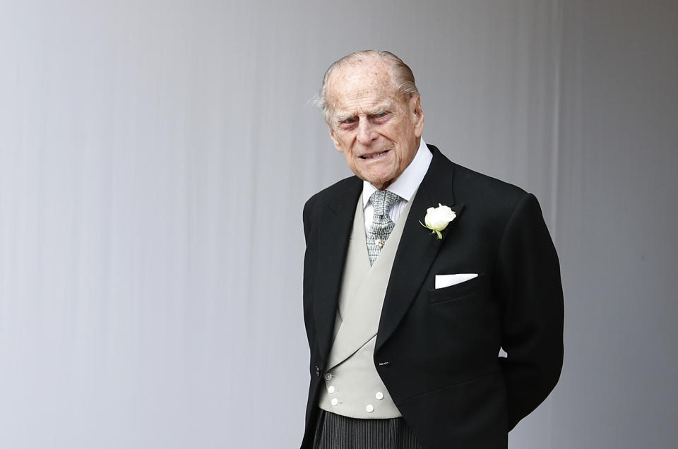 FILE - In this Friday, Oct. 12, 2018 file photo, Britain's Prince Philip waits for the bridal procession following the wedding of Princess Eugenie of York and Jack Brooksbank in St George's Chapel, Windsor Castle, near London, England. Buckingham Palace says Prince Philip has been admitted to a London hospital “as a precautionary measure.” The palace said Friday, Dec. 20, 2019 that the 98-year-old husband of Queen Elizabeth II is in the King Edward VII hospital for observation and treatment of a pre-existing condition. (AP Photo/Alastair Grant, file)