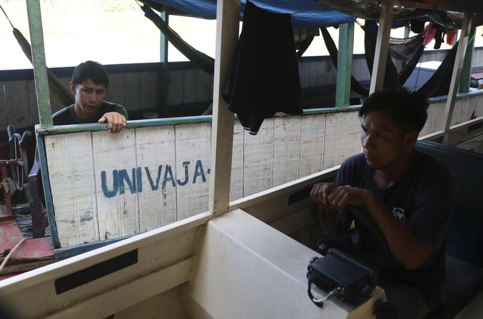 Mayuruna Indigenous men, Salomao Sebastiao, right and Raimundo Demash, members of the local association of Indigenous Univaja people, take part in the searching for British journalist Dom Phillips and Indigenous affairs expert Bruno Araujo Pereira in the Javari Valley Indigenous territory, Atalaia do Norte, Amazonas state, Brazil, Thursday, June 9, 2022. Phillips and Araujo Pereira are missing in a remote part of Brazil's Amazon region that has been marked by violent conflicts between fishermen, poachers and government agents. (AP Photo/Edmar Barros)