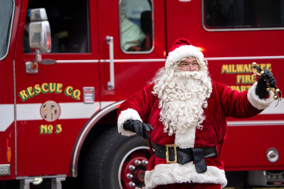 A Milwaukee firefighter dressed as Santa Claus gets ready to go up in a firetruck bucket to visit young patients and their families Monday at Children’s Hospital of Wisconsin in Wauwatosa. The bucket trucks enable children who are unable to leave their room or have visitors to see Santa Claus and superhero characters. This is the sixth annual visit by the members of the Milwaukee and St. Francis Fire Departments.