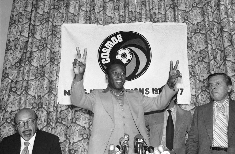 FILE- Pele of the New York Cosmos gestures during a press conference in New York on Sept. 29, 1977. Dozens of meetings over four years led to Pelé agreeing to sign with Cosmos in June 1975. His 2 1/2 seasons in New York elevated the sport, putting U.S. soccer on a path to hosting the World Cup in 1994 and launching Major League Soccer two years later. (AP Photo/Ira Schwarz, File)