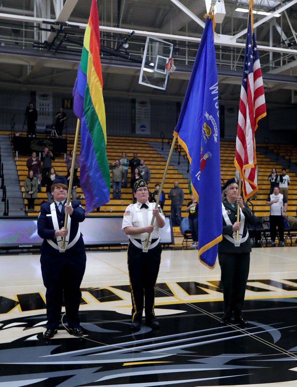 From left, Kimberly Stuart, Veterans for Diversity CEO, Denise Northway, American Legion Post 18 Adjutant, and Dawn Strobel, Color Guard officer, present the colors as they are honored as part of a University of Wisconsin-Milwaukee Women's Basketball Pride Game at Klotche Center on the University of Wisconsin-Milwaukee campus in Milwaukee on Sunday, Jan. 19, 2020. The event was hosted by Veterans for Diversity and was opened by the Veterans for Diversity's Color Guard.