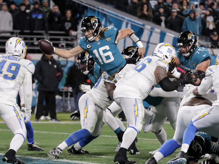 JACKSONVILLE, FL - JANUARY 14: Quarterback Trevor Lawrence #16 of the Jacksonville Jaguars dives in for a two-point conversion during the AFC Wild Card Playoffs game against the Los Angeles Chargers at TIAA Bank Field on January 14, 2023 in Jacksonville, Florida. The Jaguars defeated the Chargers 31 to 30. (Photo by Don Juan Moore/Getty Images)