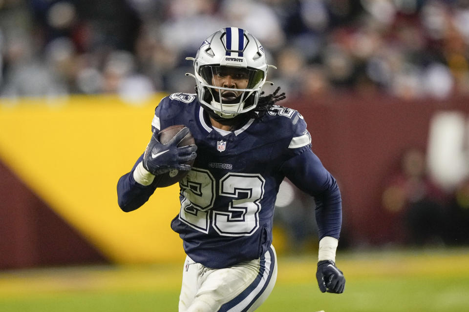 Dallas Cowboys running back Rico Dowdle (23) running with the ball against the Washington Commanders during the second half of an NFL football game, Sunday, Jan. 7, 2024, in Landover, Md. (AP Photo/Susan Walsh)