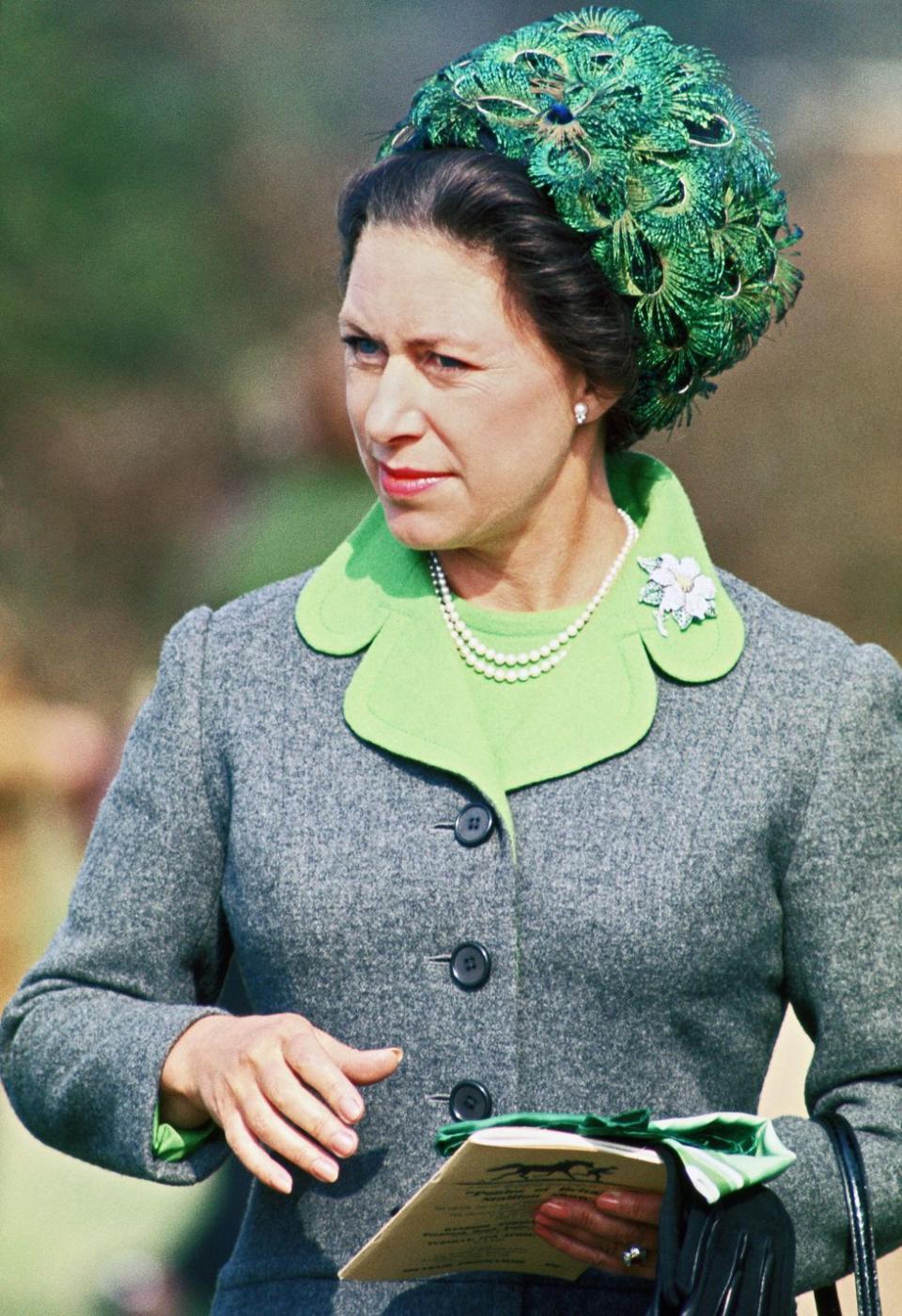 <p>Princess Margaret wears a peacock hat to a pony day at Ascot in 1973.</p>