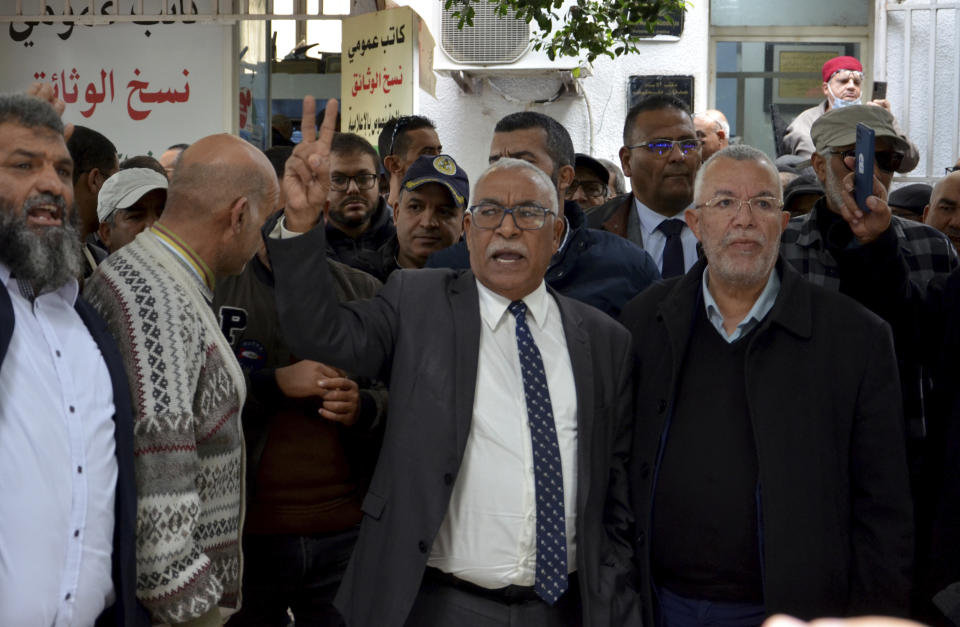 Supporters of the Tunisian Islamist movement Ennahda stage a protest in front of the justice ministry to denounce the arrest one of its senior leader in Tunis, Tunisia, Friday, Dec. 23, 2022. The protesters denounced the arrest of one of its senior leaders, suspected of being involved in sending Tunisians to fight with extremists in Syria. (AP Photo/Hassene Dridi)