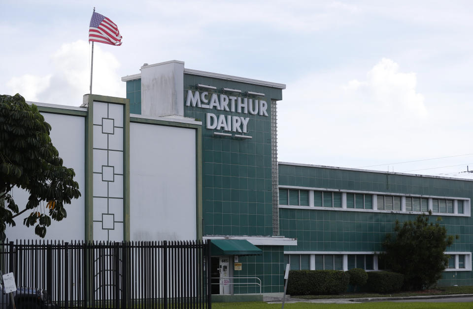 A McArthur Dairy building, a Dean Foods brand, is shown, Tuesday, Nov. 12, 2019, in Miami. Dean Foods, America's biggest milk processor, filed for bankruptcy Tuesday amid a steep, decades-long drop-off in U.S. milk consumption blamed on soda, juices and, more recently, nondairy substitutes. (AP Photo/Wilfredo Lee)