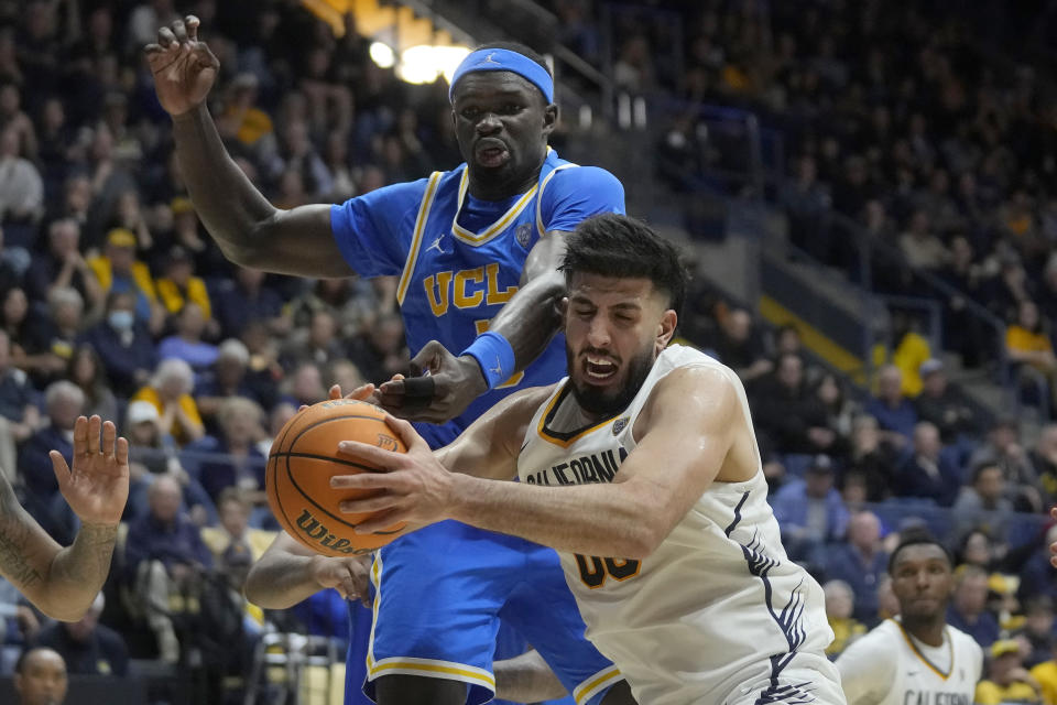 California forward Fardaws Aimaq, bottom, grabs a rebound in front of UCLA forward Adem Bona during the second half of an NCAA college basketball game in Berkeley, Calif., Saturday, Feb. 10, 2024. (AP Photo/Jeff Chiu)