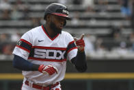 Chicago White Sox's Luis Robert gestures after hitting a home run during the first inning of a baseball game against the Detroit Tigers, Sunday, Oct. 3, 2021, in Chicago. (AP Photo/Matt Marton)