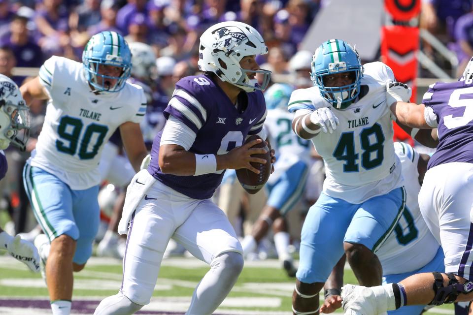 Sep 17, 2022; Manhattan, Kansas, USA; Kansas State Wildcats quarterback Adrian Martinez (9) scrambles during the first quarter against the Tulane Green Wave at Bill Snyder Family Football Stadium. Mandatory Credit: Scott Sewell-USA TODAY Sports