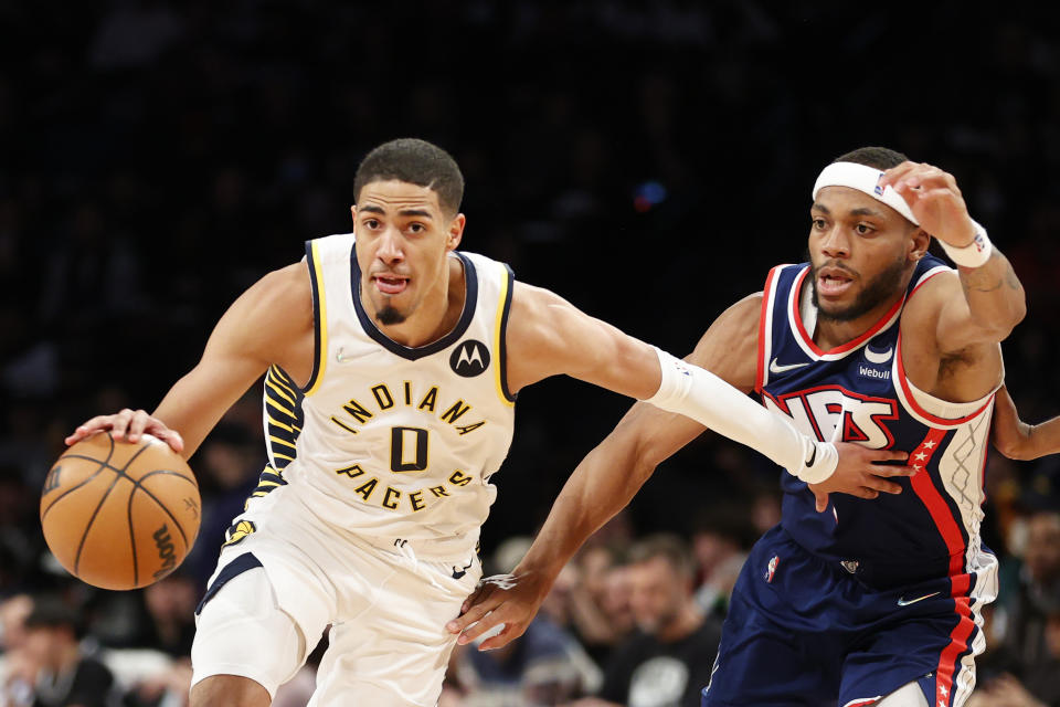 NEW YORK, NEW YORK - APRIL 10: Tyrese Haliburton #0 of the Indiana Pacers dribbles as Bruce Brown #1 of the Brooklyn Nets defends during the second half at Barclays Center on April 10, 2022 in the Brooklyn borough of New York City. The Nets won 134-126. NOTE TO USER: User expressly acknowledges and agrees that, by downloading and or using this photograph, User is consenting to the terms and conditions of the Getty Images License Agreement. (Photo by Sarah Stier/Getty Images)