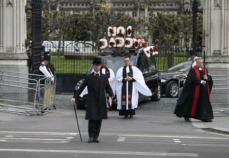 The coffin of PC Keith Palmer, who was killed in the recent Westminster attack, is transported through Carriage Gates at the Palace of Westminster, where it laid overnight, to his funeral at Southwark Cathedral in central London, Britain April 10, 2017. REUTERS/Neil Hall