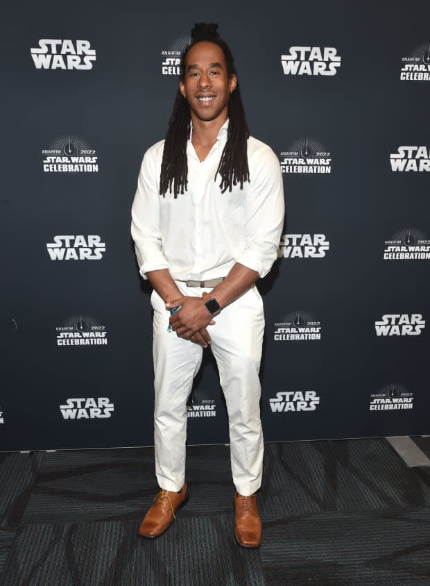 Lateef Crowder dos Santos, who is a stunt double for Din Djarin in "The Mandalorian," attends the panel for “The Mandalorian” series at Star Wars Celebration in Anaheim, California on May 28, 2022.<p><a href="https://www.gettyimages.com/detail/1399822816" rel="nofollow noopener" target="_blank" data-ylk="slk:Alberto E. Rodriguez/Getty Images;elm:context_link;itc:0;sec:content-canvas" class="link ">Alberto E. Rodriguez/Getty Images</a></p>