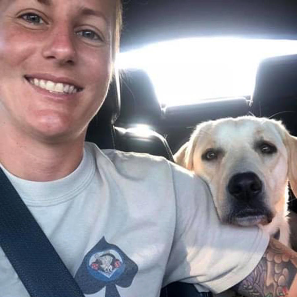 Becca Stephens in her car with her service dog, Bobbi. (K9s for Warriors)