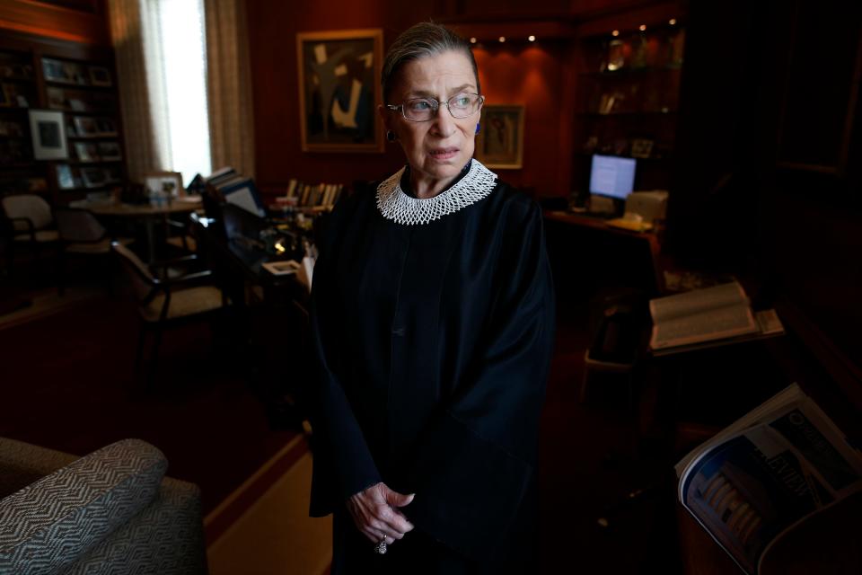 In this July 24, 2013, file photo, Associate Justice Ruth Bader Ginsburg poses for a photo in her chambers at the Supreme Court in Washington. Ginsburg developed a cultlike following over her more than 27 years on the bench, especially among young women who appreciated her lifelong, fierce defense of women's rights. She died Sept. 18, 2020.