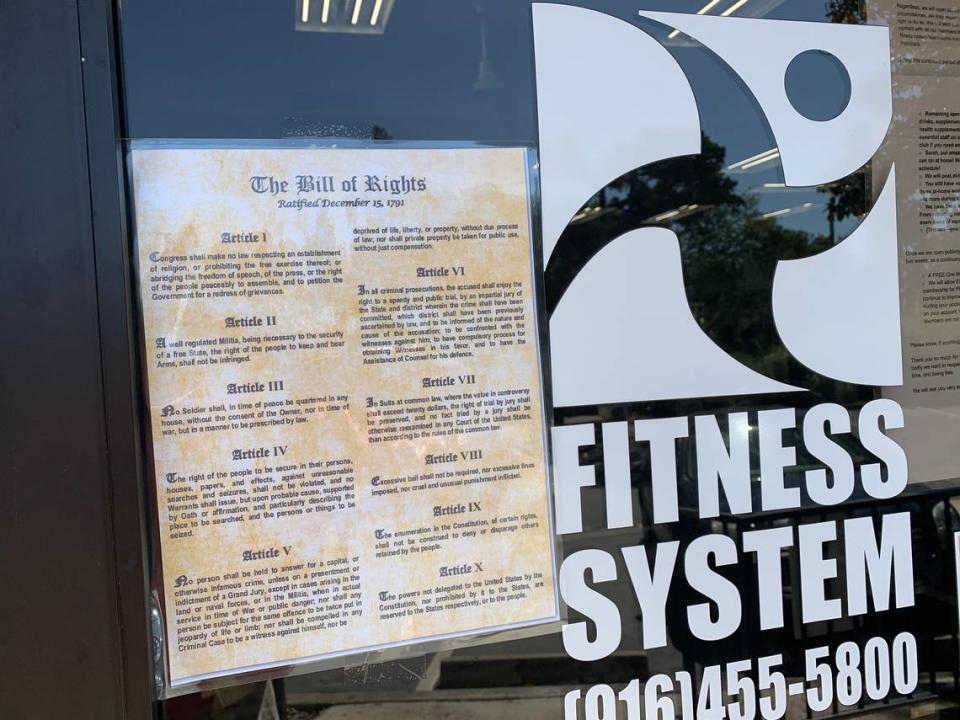 The front entrance at Fitness System’s health club in Sacramento, with a copy of the Bill of Rights taped to the door. Club’s owner says he will reopen Friday despite California’s stay-at-home order.