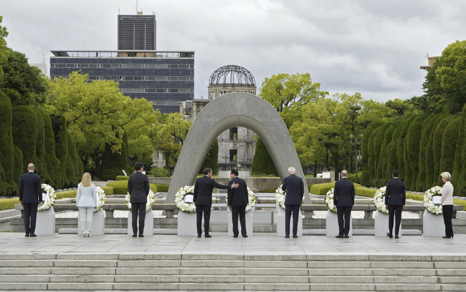 FILE- From left to right, European Council President Charles Michel, Italian Prime Minister Giorgia Meloni, Canadian Prime Minister Justin Trudeau, French President Emmanuel Macron, Japan's Prime Minister Fumio Kishida, U.S. President Joe Biden, German Chancellor Olaf Scholz, British Prime Minister Rishi Sunak, European Commission President Ursula von der Leyen lay flower wreaths at the cenotaph for Atomic Bomb Victims in the Peace Memorial Park as part of the G7 Hiroshima Summit in Hiroshima, Japan, May 19, 2023. (Franck Robichon/Pool Photo via AP, File)