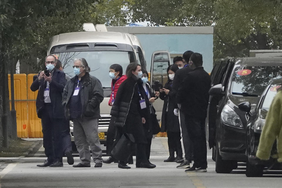 Members of the World Health Organization team depart from the Wuhan Jinyintan Hospital after a field visit in Wuhan in central China's Hubei province on Saturday, Jan. 30, 2021. The World Health Organization team investigating the origins of the coronavirus pandemic visited another Wuhan hospital that had treated early COVID-19 patients on their second full day of work on Saturday. (AP Photo/Ng Han Guan)