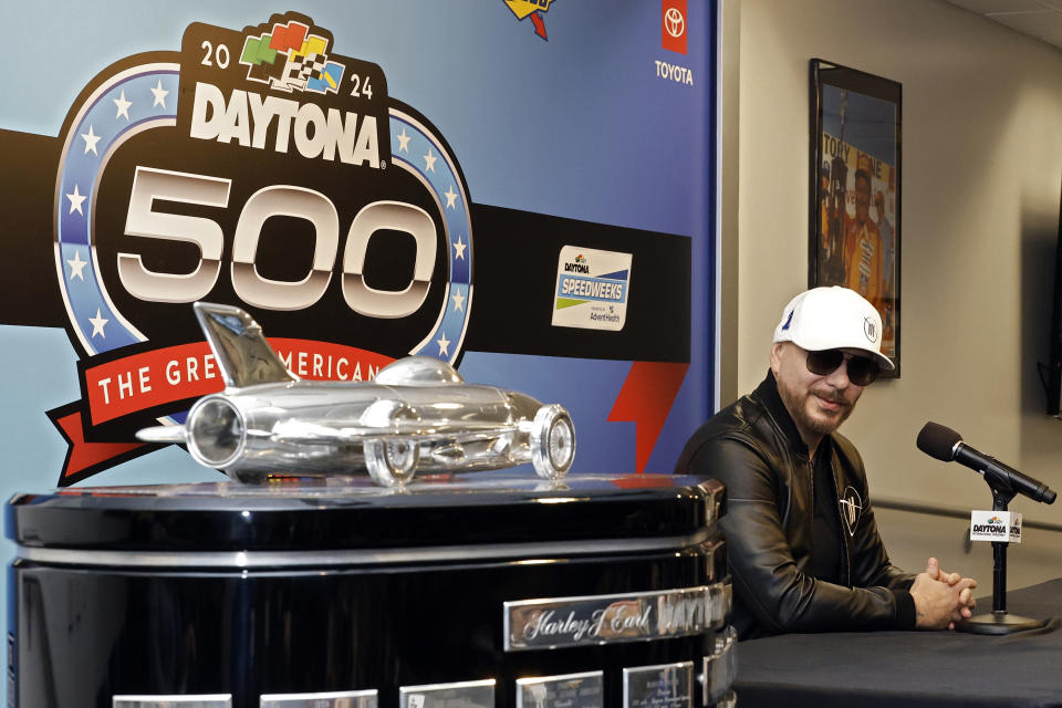 Entertainer Pitbull answers a question during a news conference after the NASCAR Daytona 500 auto race was postponed Sunday, Feb. 18, 2024, at Daytona International Speedway in Daytona Beach, Fla. (AP Photo/Terry Renna)